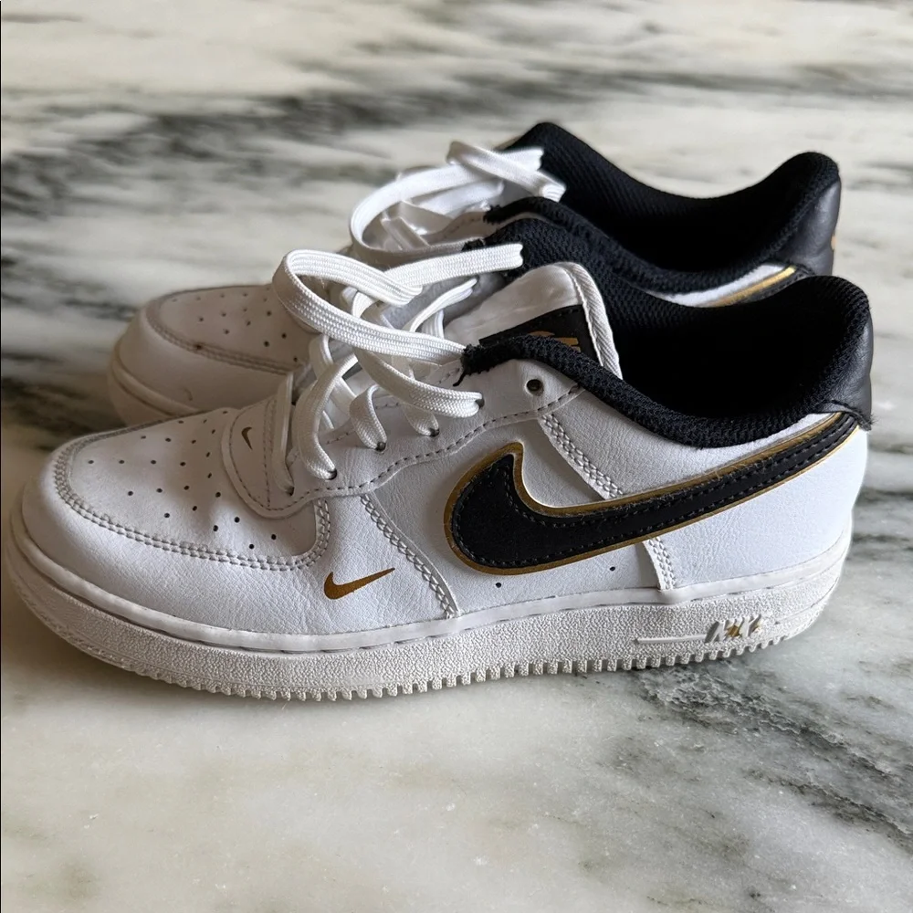 Nike White Sneakers with Black and Gold Details